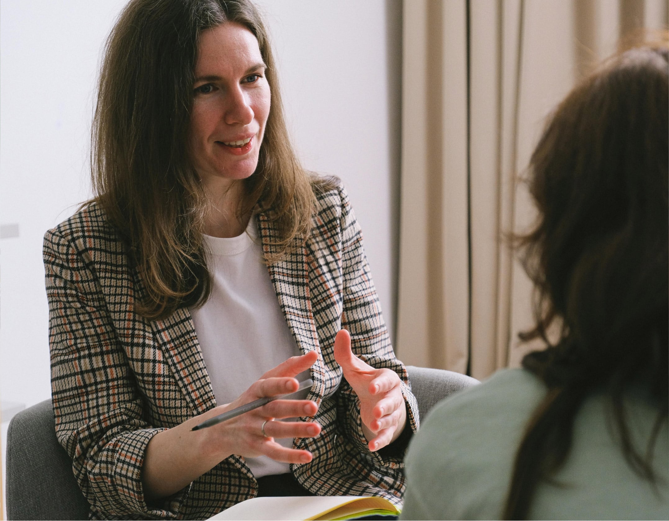 Career coach guiding a client through a resume revamp session